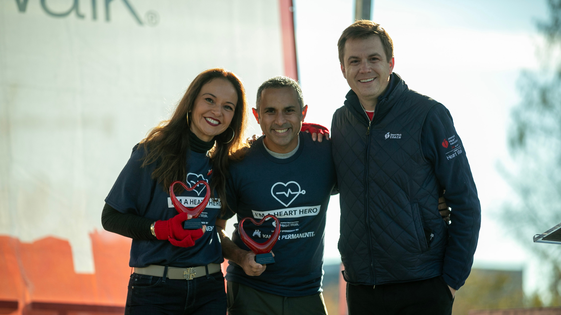 Cynthia Cifuentes, Dr. Ameya Kulkarni and Owen Billman stand on stage.