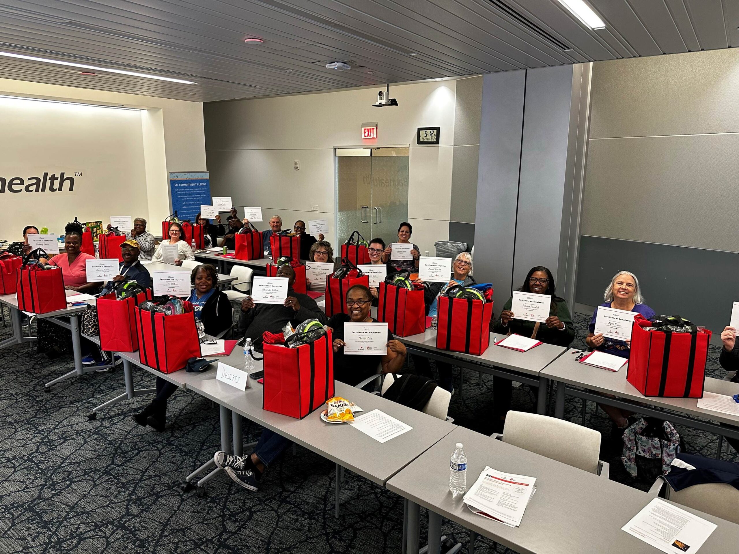 Healthy for Life participants holding up their completion certificates