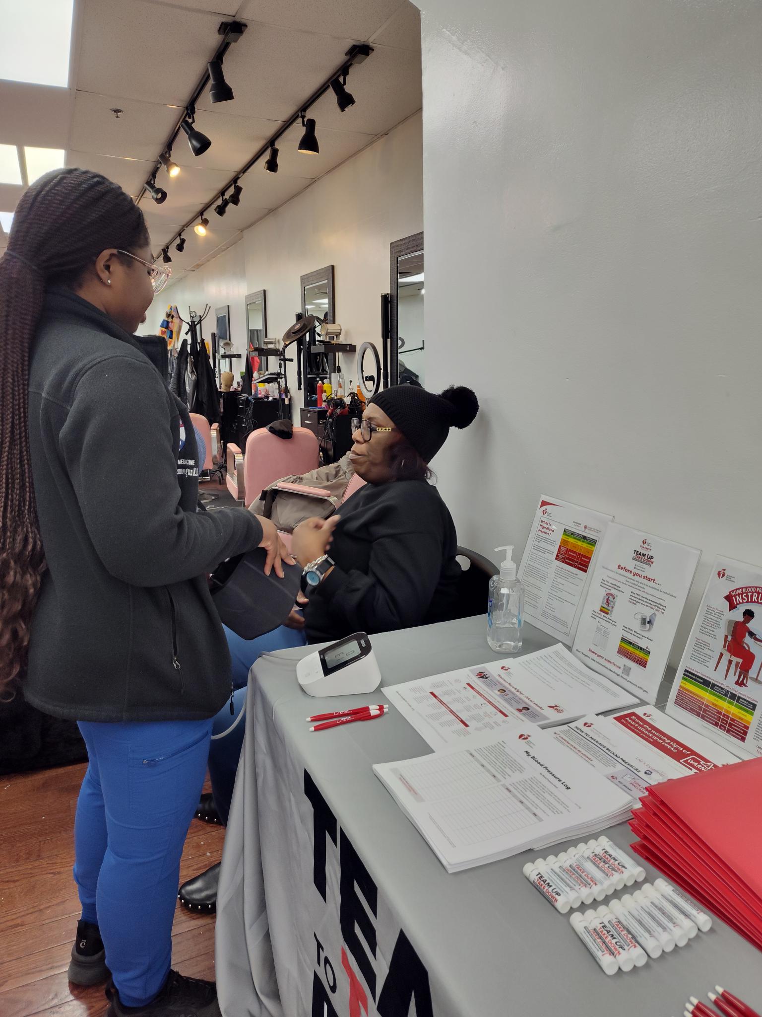 women at a table discussing heart health