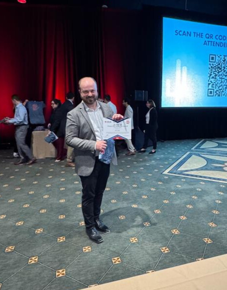 A man holding an award