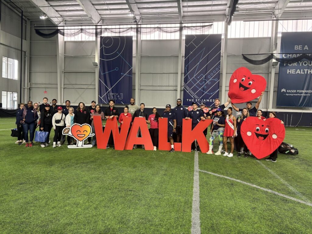 a group of people with a WALK sign in front