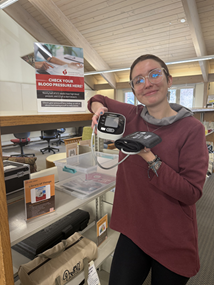 a person holding a blood pressure cuff