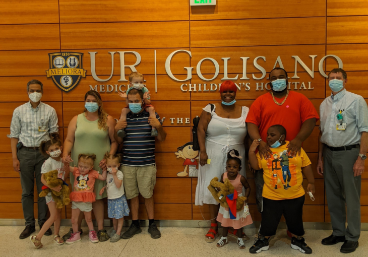Families post with doctors and teddy bears