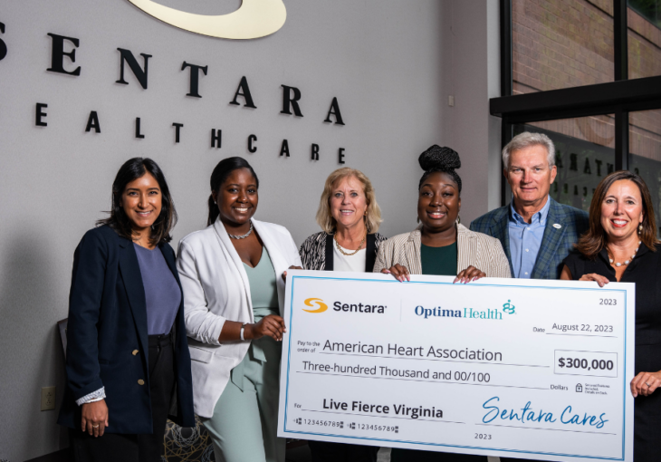 Sentara and American Heart Association staff pose for check presentation