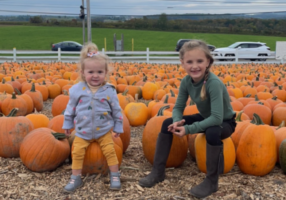 Emmie and Liberty at a pumpkin patch